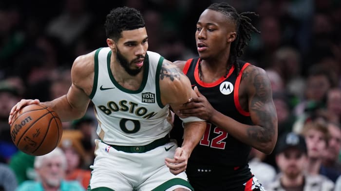 Boston Celtics forward Jayson Tatum and Bulls guard Ayo Dosunmu.